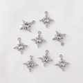 Macro detail of eight-pointed star charms with 14K gold plating and cubic zirconia - Silver Large Star Burst Single Loop Style (H-71)