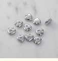 Close-up of heart-shaped silver pendants with star engraving and cubic zirconia detail - Silver Tone Heart (H-006-2)