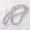 Macro detail of faceted lavender glass beads with glossy finish on white fabric - Faceted Rondelle Bead (2#) / 6mm (Approx. 100 Pieces/Pack) / Amethyst