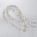 Macro shot of faceted AB clear crystal glass beads showing sparkling rainbow reflections - Faceted Rondelle Bead (3#) / 6mm (Approx. 100 Pieces/Pack) / AB Lemon Yellow