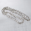 Makroaufnahme von rauchgrauen facettierten Kristallglasperlen für DIY Schmuck - Silber Champagner
