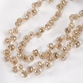 Macro shot of champagne gold faceted crystal teardrop beads for jewelry making - Champagne