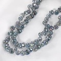 Macro view of faceted iridescent grey-blue crystal beads for DIY jewelry making - Lake Blue Purple Gradient