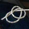 Macro shot of 5x10mm cylindrical white shell beads with natural iridescent pearl luster - Straight Tube Bead (17#) / 1 Strand (Approx 40 Beads) / White