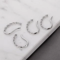 Detailed view of silver twisted ear cuffs on premium marble background for non-pierced ears - Spiral Twist Style / 12# Twisted Ear Cuff White Gold Tone