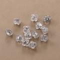 Translucent flower silicone earring backs set on soft textured fabric background - Flower Silver Plated