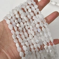 Macro shot of 5-8mm translucent irregular moonstone gravel beads for DIY jewelry making - Irregular Chips (25#) / 1 Piece / White Labradorite