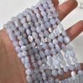 Macro shot of 5-8mm irregular light blue agate beads for DIY jewelry making and crafts - Irregular Chips (29#) / 1 Piece / Purple Agate