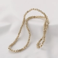 Macro view of golden hematite pumpkin beads with detailed vertical stripes for jewelry - KC Gold
