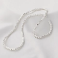Polished silver pumpkin-shaped beads for DIY jewelry making displayed on soft white fabric - Approx 110 Pieces/Pack / Matte Silver