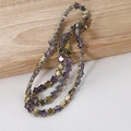 Macro detail of 8mm purple star beads with metallic golden finish for jewelry making - Approx. 80 Beads per String / Star Half Bronze Purple