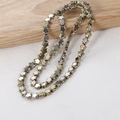 Close-up of 8mm metallic star-shaped beads for jewelry making on a wooden display - Approx. 80 Beads per String / Star KC Gold