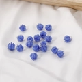 Detailed view of lily-of-the-valley glass flower beads in cobalt blue for DIY jewelry - 1 Piece / Blue