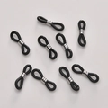 Macro shot of 8-piece black silicone eyeglass chain connectors with silver metal loops - White K Ring Black Silicone (14#)
