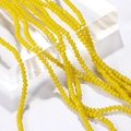 Macro-opname van 3 mm gele gefacetteerde kristallen glasparels voor sieraden - Set van 100 stuks / Porseleingeel (6#)
