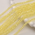 Detail van 3mm gele gefacetteerde kristalglazen kralen voor DIY sieraden op wit dienblad - Set van 100 stuks / Geel AB (20#)