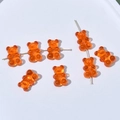 Detailansicht orangefarbener Bärenperlen mit Loch für die DIY-Schmuckherstellung - Horizontale Bohrung / 10er Pack / Orange