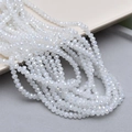Macro shot of 4mm faceted AB crystal glass round beads with iridescent rainbow coating - 1# White Jade AB