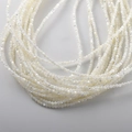 Macro shot of 4mm white mother of pearl shell beads with natural iridescent luster for DIY - 12# White Mother of Pearl Round Beads / 128 Pieces (3-3.5mm) / White