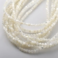 Macro shot of 4mm polished cream white natural shell beads for DIY jewelry making - 13# White Mother of Pearl Round Beads / 200 Pieces (2-2.5mm) / White