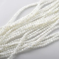 Close-up of 4mm white mother of pearl round beads with natural iridescent luster for DIY - 11# Trochus Shell Round Beads / 116 Pieces (3-3.6mm) / White