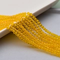 Macro detail of faceted 4mm yellow crystal glass beads for DIY jewelry making - 5# Orange