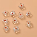 Macro detail of handmade clear glass flower beads with orange center for DIY jewelry making - Large Floral / Transparent White Large Flower