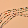 Close-up of mixed natural stone beads in curved rows for DIY jewelry making - 3mm Round Mixed Color