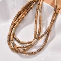 Macro view of cylindrical picture jasper beads with natural textures on ceramic plate - 7# Mixed Stones
