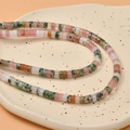 Colorful natural stone abacus beads arranged in a ceramic dish for DIY jewelry making - 4-5mm Spacer Mixed Color