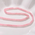Macro view of cylindrical pink crystal beads with smooth polished finish for DIY jewelry - 30# Dark Pink Quartz [approximately 28 Beads Per Piece]