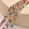 Macro view of colorful 2mm square glass sugar beads for DIY bracelet and necklace jewelry - Light Mixed