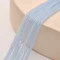 Macro shot of 2mm light blue faceted square glass crystal beads for DIY jewelry making - Light Blue Jade