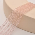 Macro detail of 2mm faceted peach crystal square beads for DIY jewelry making - Water Pink