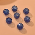 Macro view of blue faceted hollow glass beads with geometric cuts for DIY jewelry making - 1 Piece / Dark Blue