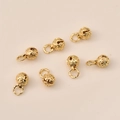 Macro shot of 14K gold plated hollow bell charms with starry sky patterns for DIY jewelry - 8mm Diameter / Gold Style