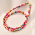 Rainbow flat heishi beads in a ceramic tray for DIY handmade jewelry crafting - Pastel Rondelle Style (13#)