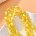 Lemon yellow 8mm heart-shaped cat-eye stone beads for DIY jewelry and necklace crafting - Tender Yellow Cat's Eye