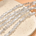 Detailed view of 8mm heart-shaped cat eye stone beads for DIY jewelry making - Light Gray Cat's Eye