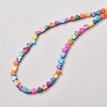 Macro shot of colorful heart-shaped natural shell beads with iridescent luster for DIY jewelry - Small Size / Heart Style