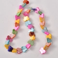 Detailed view of colorful butterfly shaped shell beads with natural pearlescent luster - Large Size / Butterfly Design