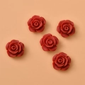Detail showing five red resin 12mm rose flower cabochons for DIY jewelry making and crafts - Red