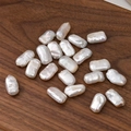 Irregular baroque freshwater pearls on dark wood tray for DIY jewelry making - 1 Bead