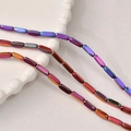 Macro shot of colorful iridescent rectangle hematite loose beads for DIY jewelry making - #21 Rose Red Gold 3x9 Beveled Square [approximately 42 Pieces]