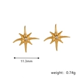 Detailed close-up of 11.3mm gold starburst stud earrings with central round zircon - Star Flare Rhinestone Style (STE24539)