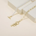 Elegant gold paperclip and pearl necklace featuring a large letter F pendant and OT clasp - Letter F