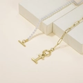 Chic OT buckle pearl and gold chain necklace featuring a polished letter H pendant - Letter I