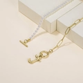 Gold paperclip chain and white pearl necklace featuring a letter J pendant and OT buckle - Letter J