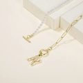 Gold paperclip chain pearl necklace featuring an initial N pendant and toggle clasp - Letter N