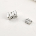 Macro detail of silver magnetic cylinder bead with knurled texture for jewelry making - 3# White K Magnetic Tube Bead (Approx 10x4mm)